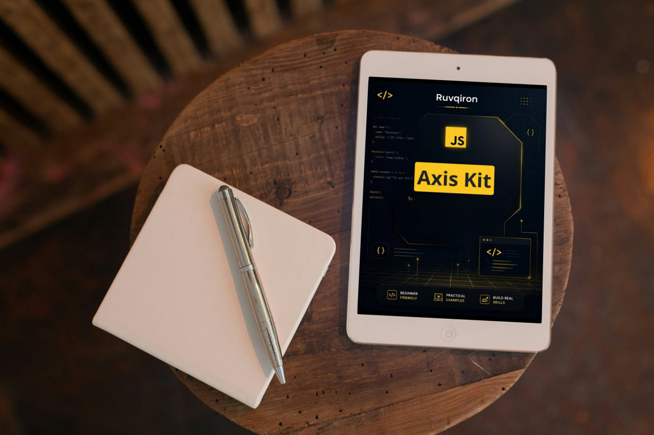 Tablet displaying 'Axis Kit' on a wooden table with a notebook and pen.